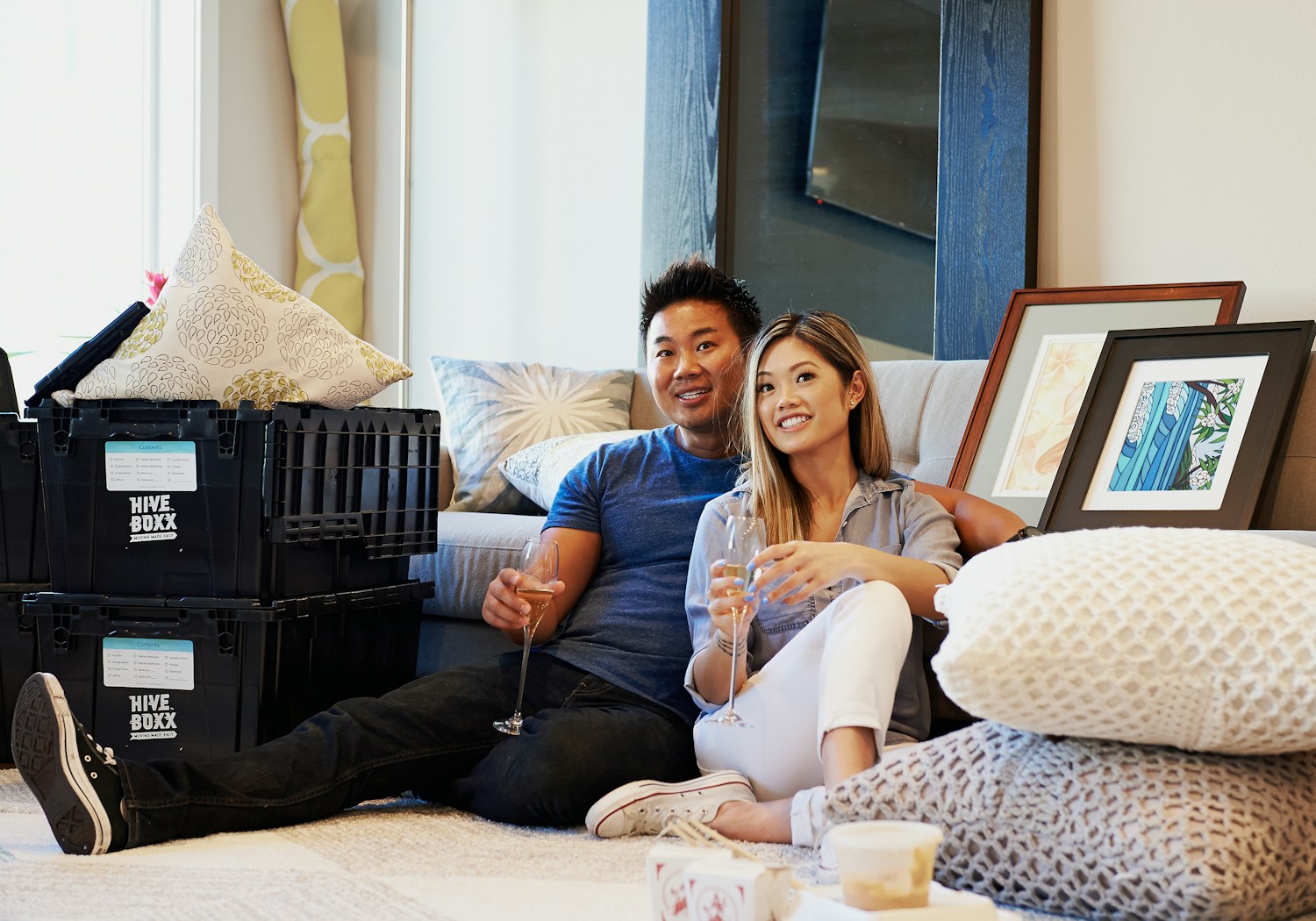 A couple relaxing in their new home after an Easy Peasy move